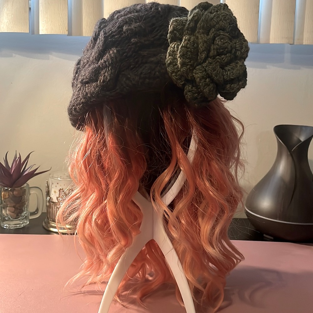 NWOT knitted deep brown slouchy cap with olive green flower accent. By Mojo Spa.